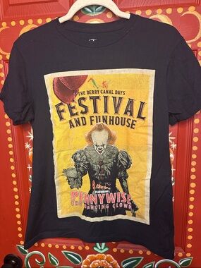 Hot Topic Black Pennywise Festival Graphic Tee with Yellow Print